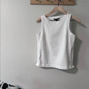 Sleeveless white top with embroidered sides